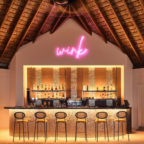 Wink Bar interior with stools and shelves