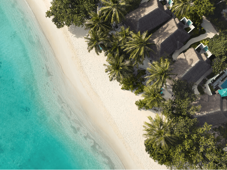 Aerial of the white sandy beaches and and villas at Nova Maldives