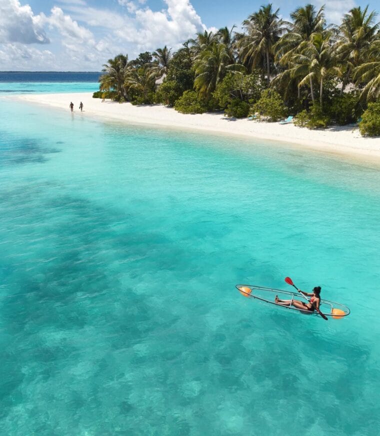 A person kayaking in a lagoon