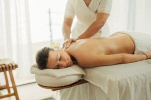 a woman getting a massage at a spa